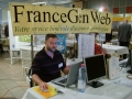 Antoine sur le stand FranceGenWeb
